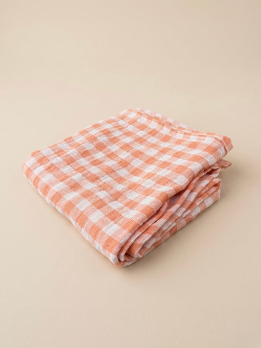 Swaddle XL - Oranje geblokt, met effen oranje achterkant.
