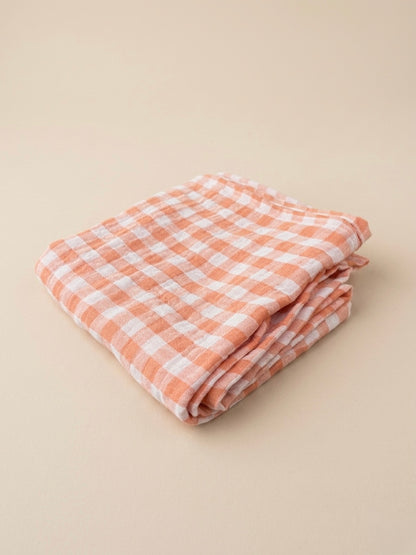 Swaddle XL - Oranje geblokt, met effen oranje achterkant.